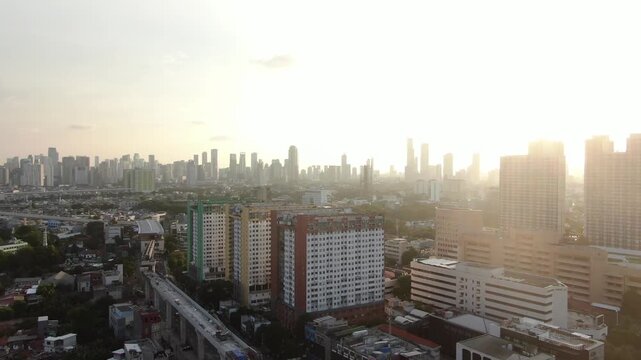 Jakarta, Indonesia &ndash; April 26th 2026: Aerial Cityscape Skyline at Sunset with Modern High Rise Buildings and Elevated Train Track
