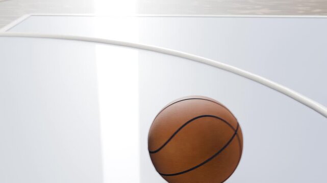Descending orange basketball bouncing and rolling on polished gym court arc, showing ceiling beams