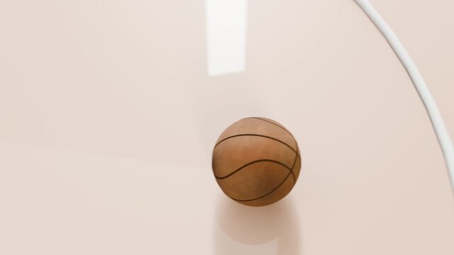 Shot release sending basketball falling and spinning onto cream court in arena, rim visible
