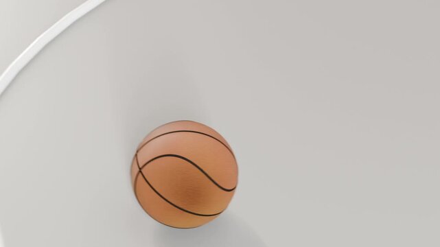 Dropping basketball through gap, bouncing, rolling on glossy court inside arc and settling center