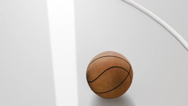 Camera shifting, basketball falling past rail, bouncing and settling on white platform for showcase