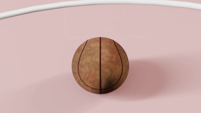 Falling ball rotating and settling to rest on pink court beneath white rim, passing pattern panel