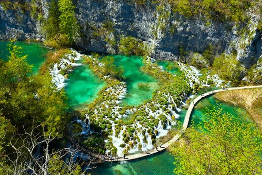 Aerial view of tufa watefall cascades and a wooden walkway at Plitvice lakes national park in Lika, Croatia