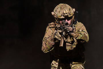 Fototapeta premium Tactical Soldier Aiming Rifle In Camouflage During Military Training Exercise With Night Vision