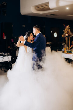 first dance of the bride and groom inside a restaurant
