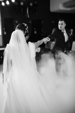 first dance of the bride and groom inside a restaurant