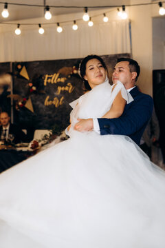 first dance of the bride and groom inside a restaurant