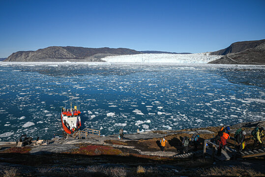 Eqi Glacier, Disko Bay, Western Greenland - Red Boat Landing Below Arctic Glacier