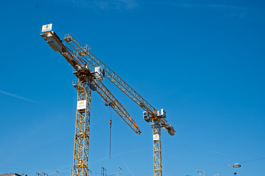 Zurich, Switzerland, April 23, 2026. Landolt construction cranes over a modern building site in the Oerlikon district