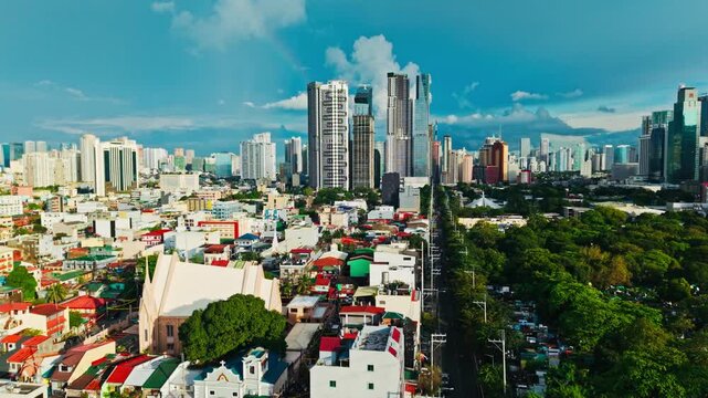 Colorful urban buildings contrast with green trees in Makati Manila scene