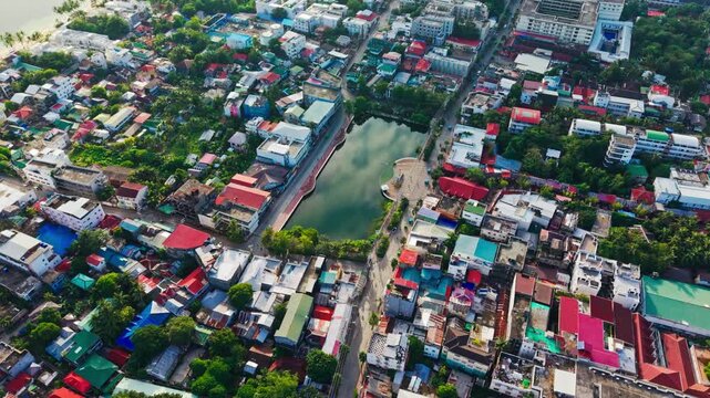 Drone captures sunrise over Balabag Lake and colorful Boracay town Philippines