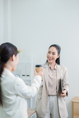 Fototapeta premium A successful Asian businesswoman, looking confident and smiling.