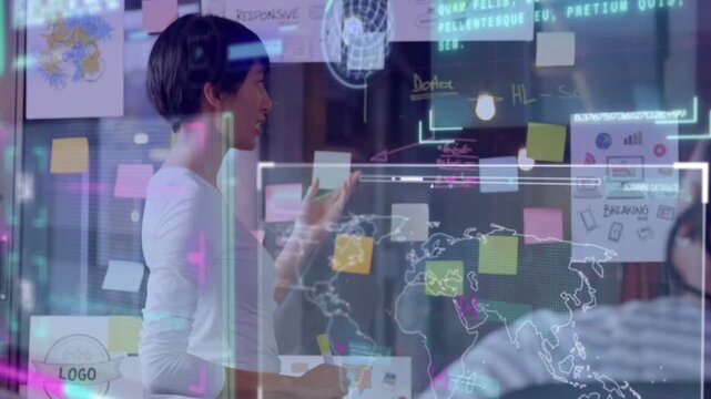 Woman presenting business plan, starting, turning, pointing at glass map overlay, touching notes