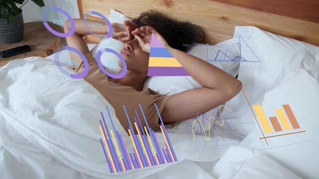 Woman waking to morning light, stretching and checking animated business charts over printed papers