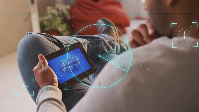 Man tapping tablet on couch, swiping to rotate 3D schematic, HUD scan highlighting areas for design