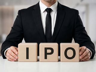 Obraz premium premium banker behind ipo blocks representing stock market launch equity investment and public offering concept