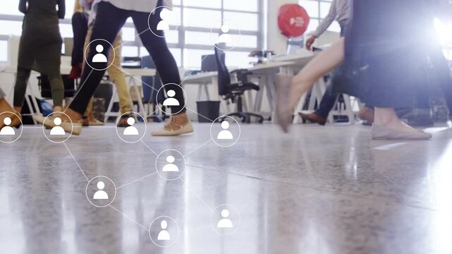 Office coworkers walking, footsteps initiating network overlay across floor, visualizing user icons
