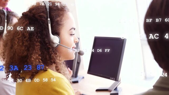 Support agent taking call speaking on headset turning to camera smiling with code overlay drifting