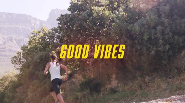 Woman entering frame running along sunlit hill trail for fitness, yellow GOOD VIBES title shifting