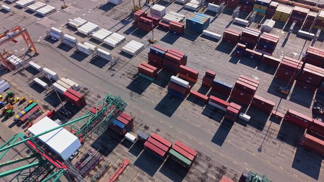 Aerial View Cargo Terminal With Cranes And Trucks Working At Port Halifax Nova Scotia Canada Daytime Loading And Unloading Containers Logistics Global Trade 4K 