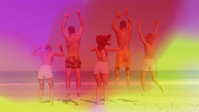 Five adults taking group cue, raising arms and jumping on beach with gradient overlay for marketing