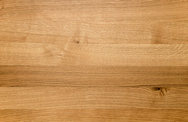 Close up of a wooden surface background, showing warm brown wood grain texture. Perfect for backgrou