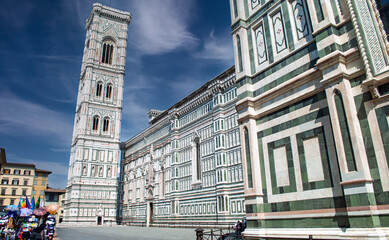 Naklejka premium Piazza del Duomo in Florence, with a particular focus on Giotto's majestic Bell Tower next to the Cathedral of Santa Maria del Fiore.