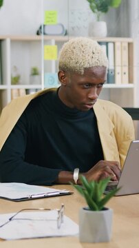 Smart caucasian guy using headphones video call communicate with business colleague friend from office room during brainstorming clapping hands. Slow motion