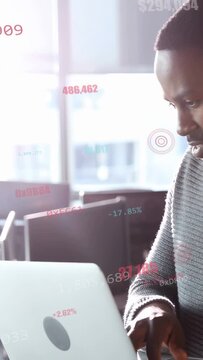 Vertical video: Developer opening laptop and typing near window causing hex numbers checking KPIs
