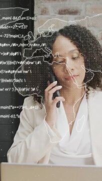 Vertical video: Woman checking phone after buzz, calling while viewing laptop map and data for work
