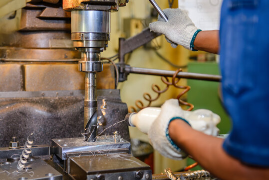 Large diameter hole making process on NC milling machine with manual feed liquid cooling by skilled operator.