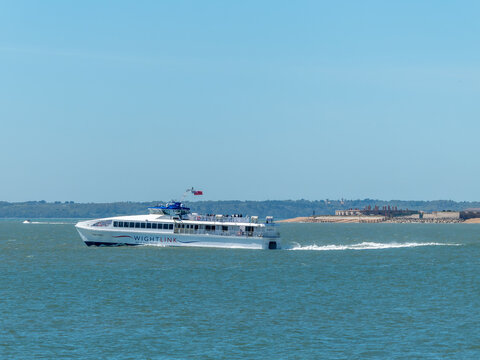 Portsmouth England - April 24 2026: Wightlink Ferries Fastcat Catamaran Wight Ryder I in The Solent with Gilkicker Fort in the background