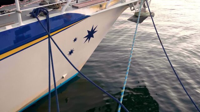 White sailboat hull with blue ropes and star decal in Santa Cruz de Tenerife