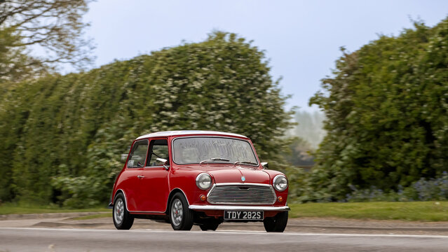 Bicester,Oxon.,UK - Apr 26th 2026: 1978 red British Leyland Mini car driving on a British road