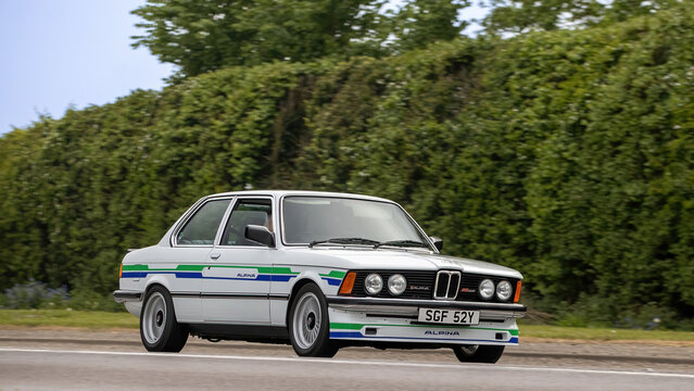 Bicester,Oxon.,UK - Apr 26th 2026: 1982 white 3 series BMW 323i car driving on a British road