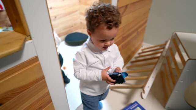 Curious toddler exploring and playing at daycare
