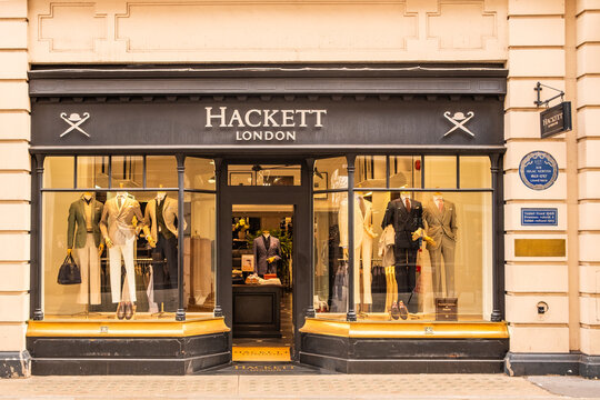 LONDON - Jermyn Street St James Hackett London tailoring shop storefront with mannequins and Newton plaque