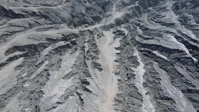 Aerial top-down view of extreme erosion and geological textures on Mount Bromo's volcanic crater.