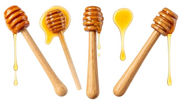 Wooden honey dippers with golden syrup dripping, isolated on white