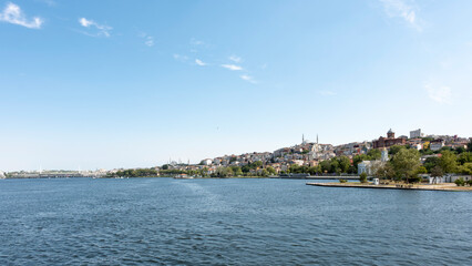 Fototapeta premium A city view from the Golden Horn in Istanbul, showing mosques and churches.