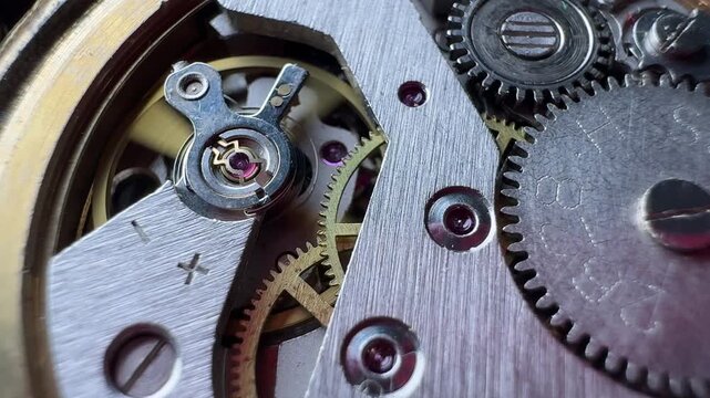 Macro close up of luxury watch mechanism with moving gears