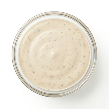 french onion dip in transparent glass bowl top view isolated on white background representing premium creamy gourmet condiment and food packaging concept