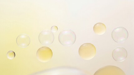 Fototapeta premium A close-up view of transparent bubbles floating in a soft yellow and white gradient background