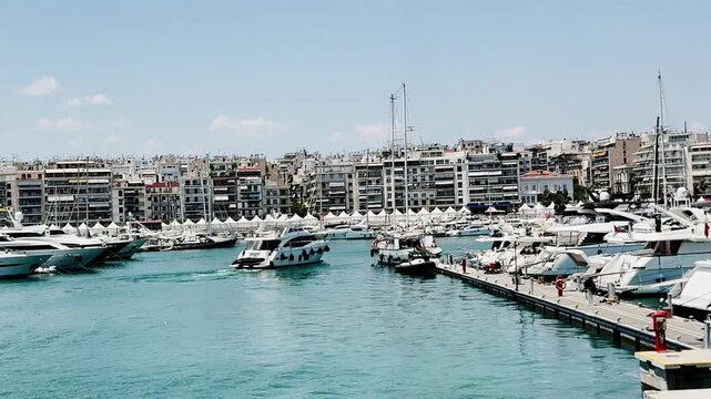 Motor yacht departing piraeus marina in athens greece