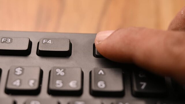 Keyboard Close Up of Man Using F5 Key for Web Page Reload Shortcut