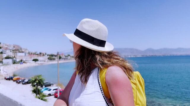 Young female traveler vlogging in piraeus, athens