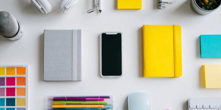 Flat lay of colorful supplies and gadgets