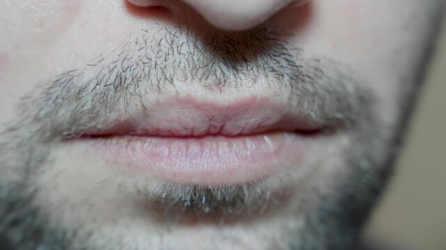 male lips close up detail, facial hair grooming concept for skincare and hygiene advertising content