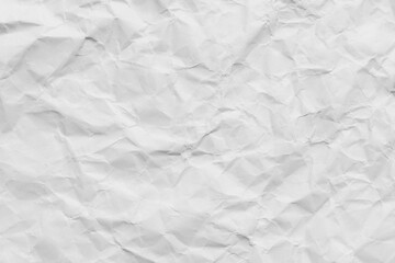 Naklejka premium White crumpled paper texture background,Macro,High angle view of white crumpled paper texture background, full frame. Detailed surface of creased and wrinkled paper for background and design elements.