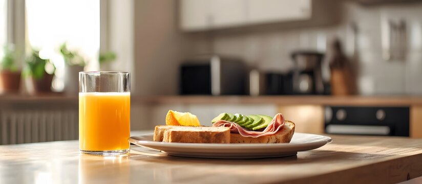 Breakfast with avocado and ham toast and orange juice
